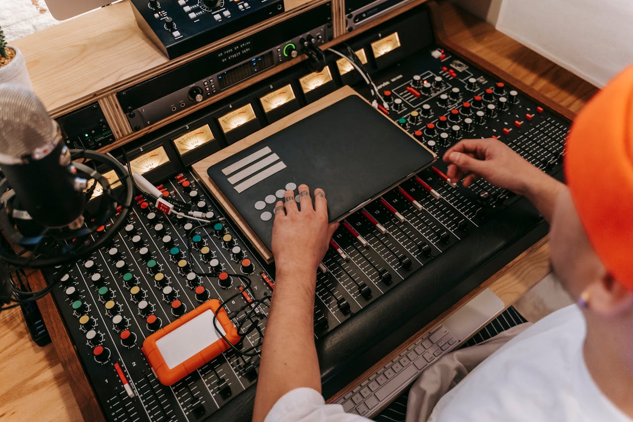 High Angle view of a Man Using a Sound Mixer